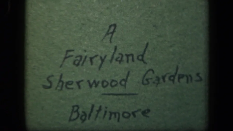 Close title-card frame names A Fairyland Sherwood Gardens Baltimore, with visible paper texture and film softness.