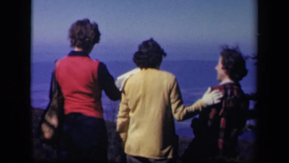 Three women at Skyline Drive in Virginia, seen from behind at a windy overlook in 1943 home-movie footage.