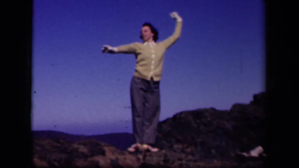 The 1943 Skyline Drive frame shows the woman changing poses on the rocky hilltop, with one arm extended and one lifted.