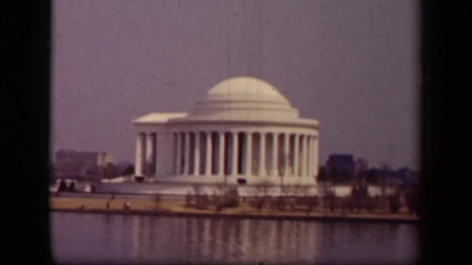1943 8mm view of the Jefferson Memorial in Washington, DC from across the Tidal Basin under hazy light.