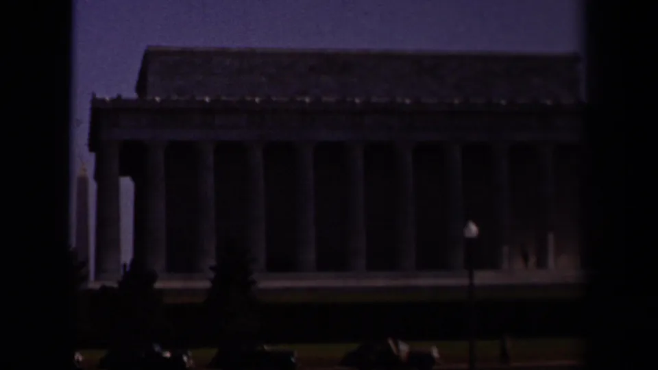 Closer, darker 1943 Washington DC view of the Lincoln Memorial facade, showing tall columns and a small lamp post in the foreground.