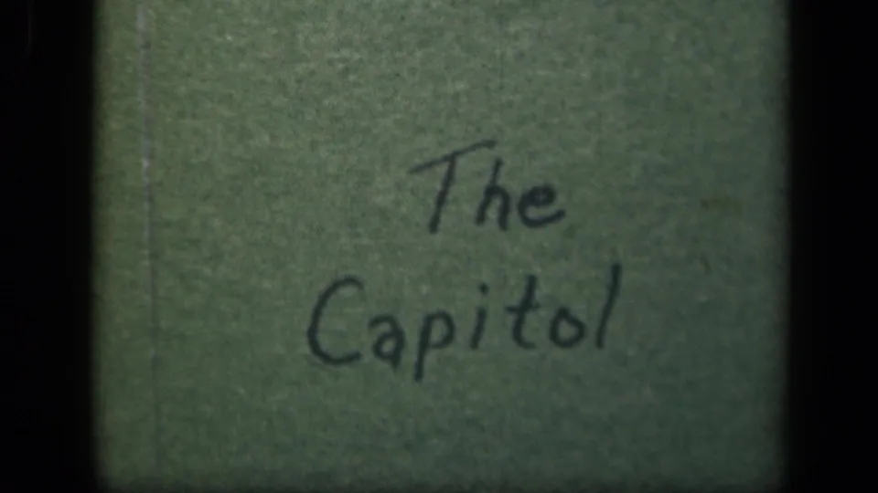 Handwritten 8mm title card reading "The Capitol," supporting the supplied Washington DC location context for the clip.