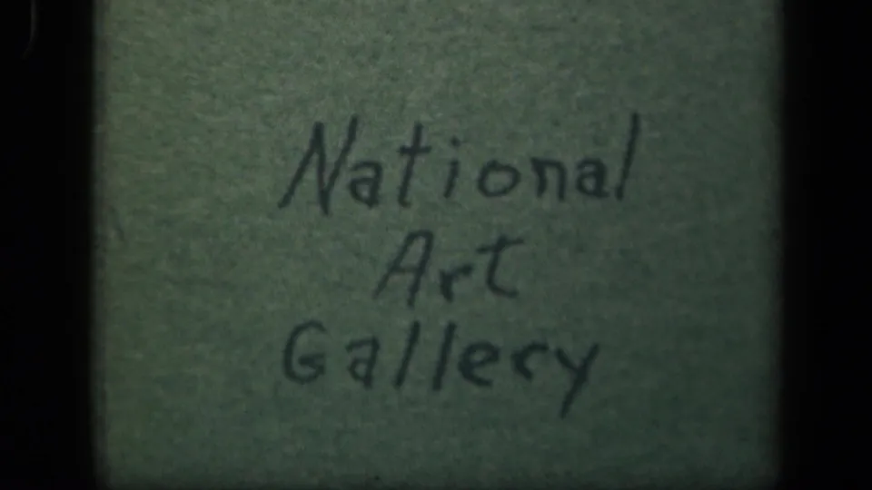Handwritten green title card reading National Art Gallery, likely used as a home-movie location note for the Washington, DC reel.