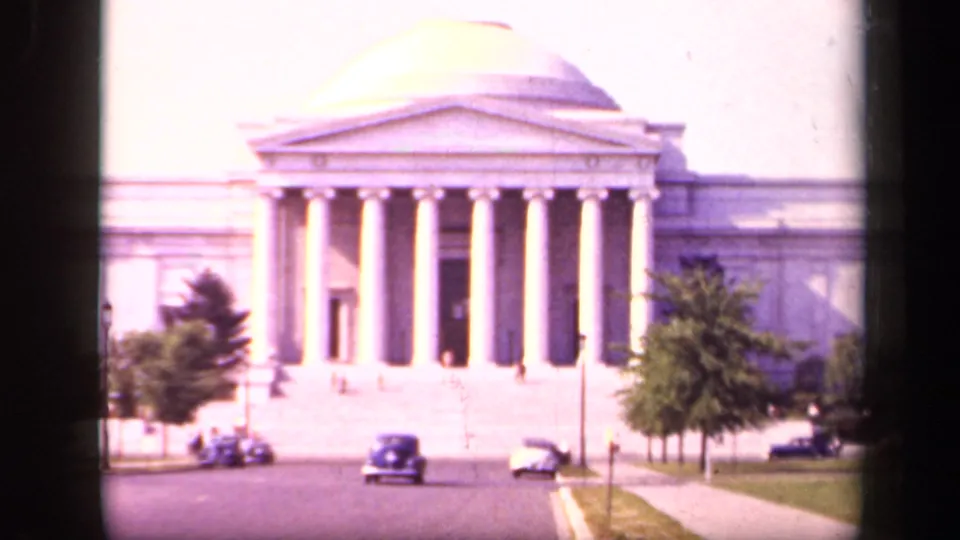 National Art Gallery exterior in Washington, DC, with dome, columns, roadside trees, and 1940s automobiles visible.