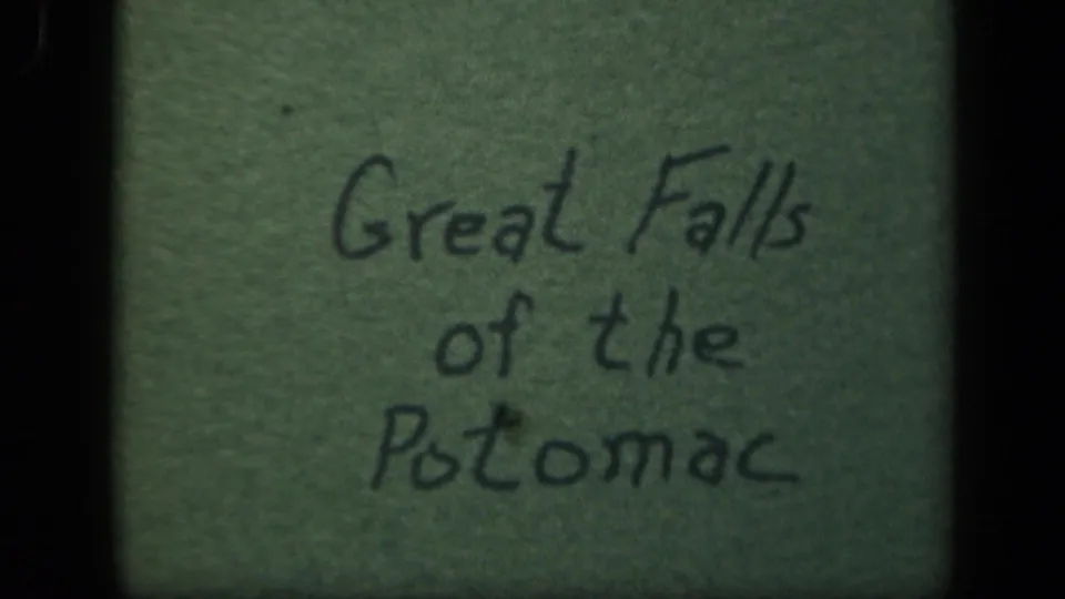 Green home-movie title card with handwritten Great Falls of the Potomac text, framed by rounded black 8mm edges.