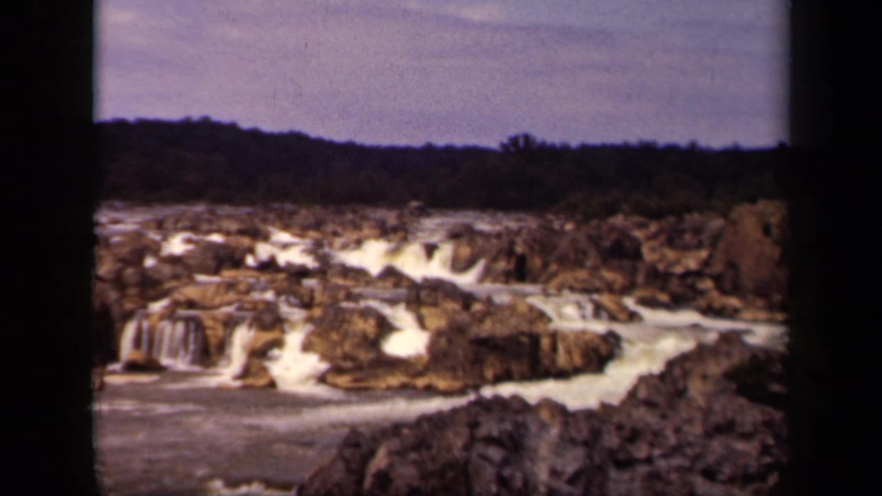1943 Washington, DC nature frame showing whitewater and small falls across a rocky riverbed.