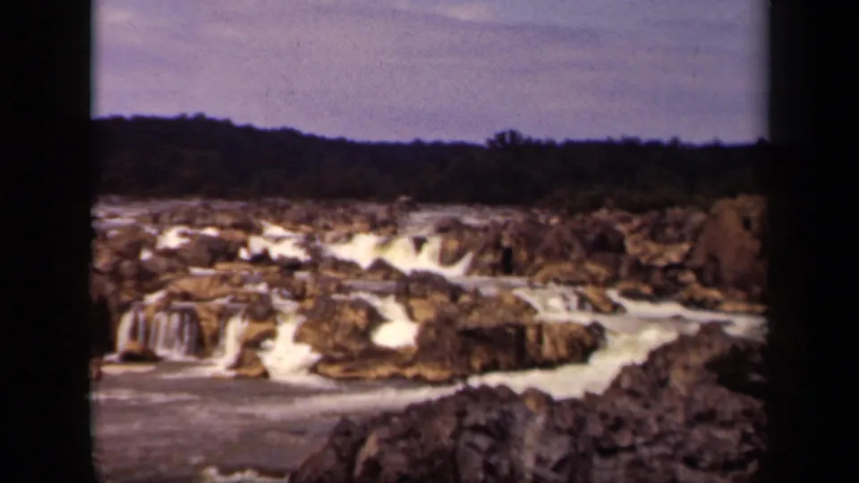 1943 Washington, DC nature frame showing whitewater and small falls across a rocky riverbed.