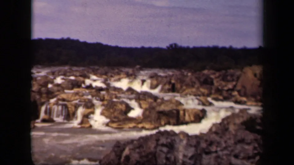 Final 1943 home-movie frame of water flowing through rocky formations in Washington, DC.