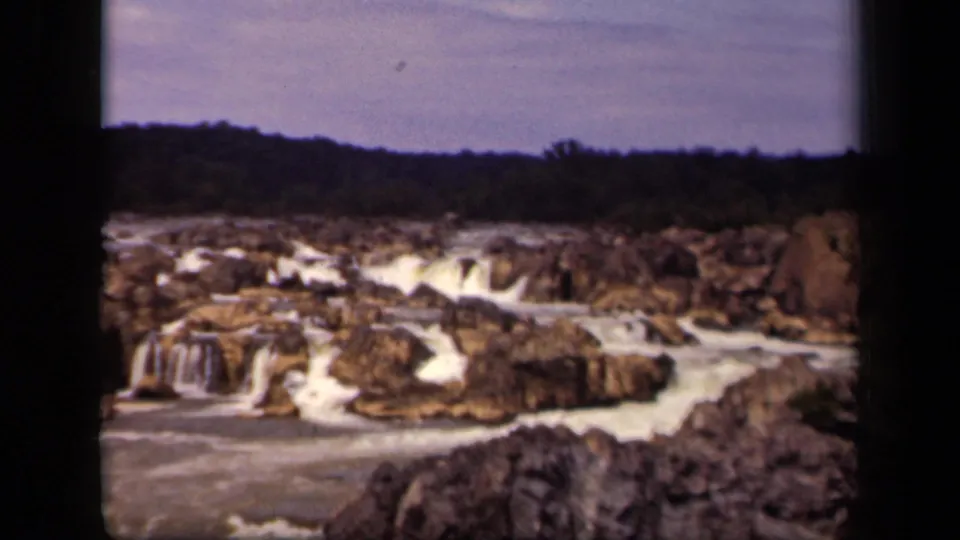 A soft 8mm view of small waterfalls and exposed rocks, identified by metadata as Washington, DC in 1943.