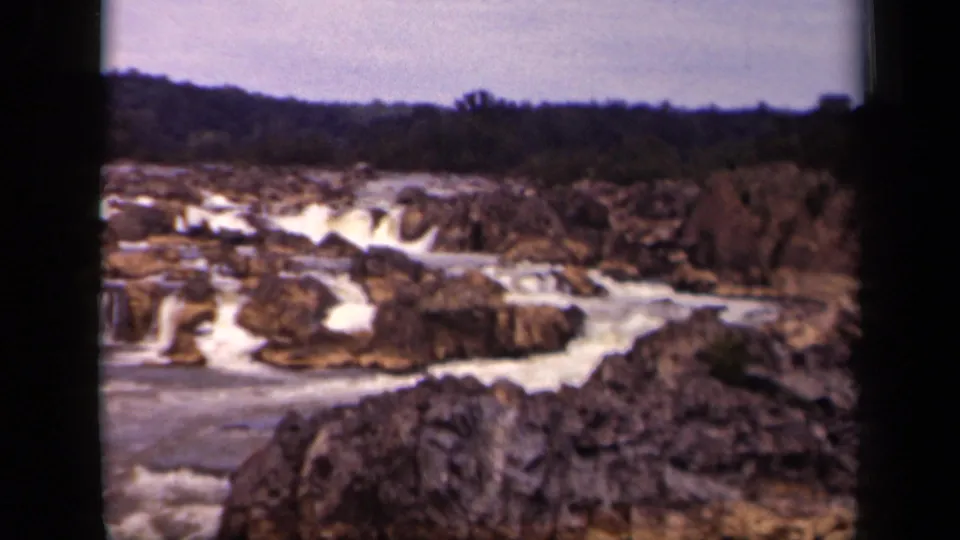 End-frame view of a rocky waterfall and river channel from a 1943 Washington, DC 8mm home movie.