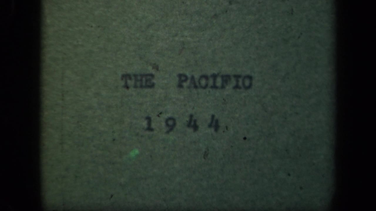 Pacific 1944 title card remains visible on textured green paper, with muted color, grain, and dark 8mm borders.