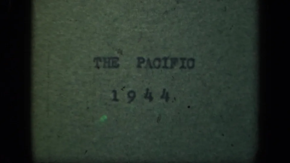 Pacific 1944 title card remains visible on textured green paper, with muted color, grain, and dark 8mm borders.