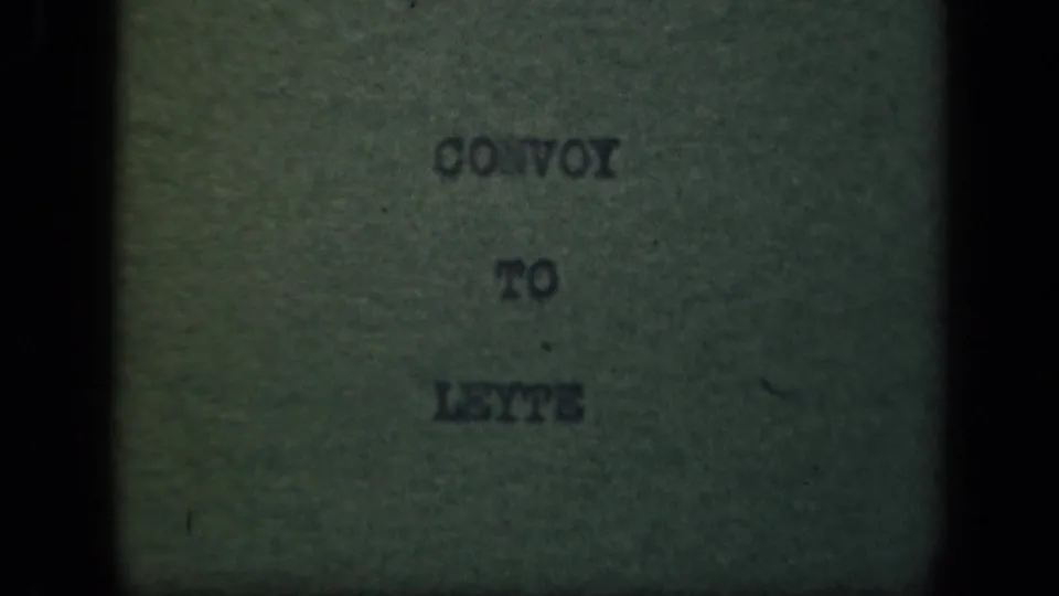 Final frame of the CONVOY TO LEYTE title card, showing typed lettering, green paper, soft focus, and aged 8mm film borders.