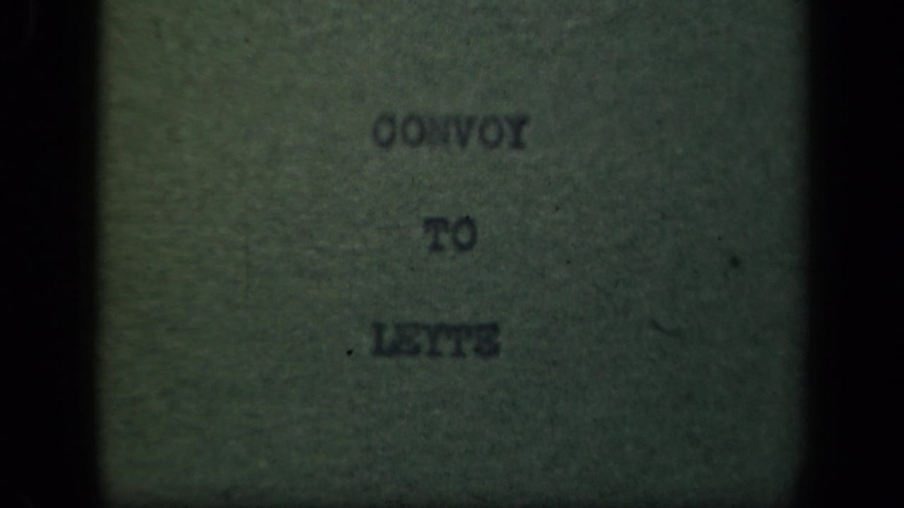 1940s 8mm title card reading “Convoy to Leyte,” seen through dark gate edges and soft focus.