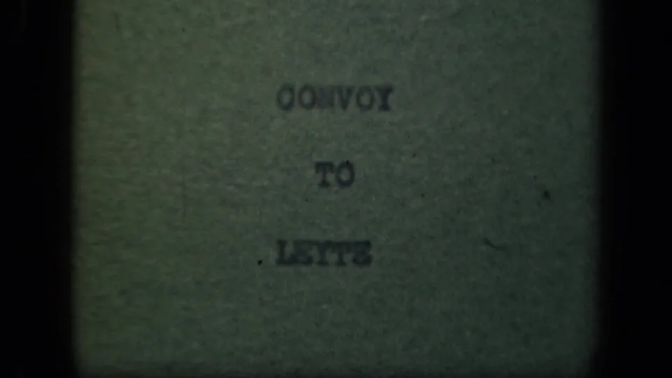 1940s 8mm title card reading “Convoy to Leyte,” seen through dark gate edges and soft focus.