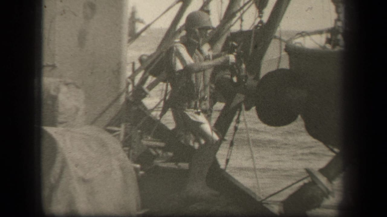 Helmeted soldier stands near ship rigging and a small boat at sea.