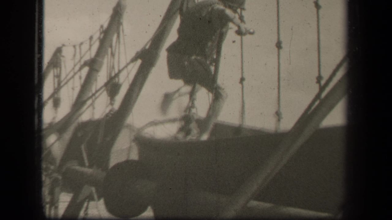 The man moves through the sailboat rigging, partly silhouetted against the pale sky in the supplied Leyte Gulf setting.
