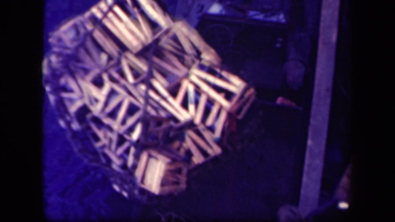 Wooden cargo crates seen from above on a dark deck area.