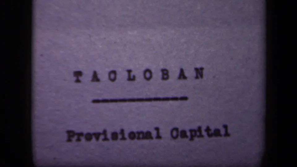 1944 Leyte Gulf Philippines 8mm frame showing a typewritten Tacloban title card with Provisional Capital below an underline.