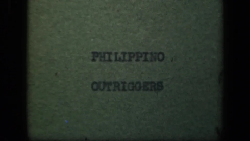1940s 8mm title card in the Philippines reel reading “PHILIPPINO OUTRIGGERS,” shown with soft focus and film grain.