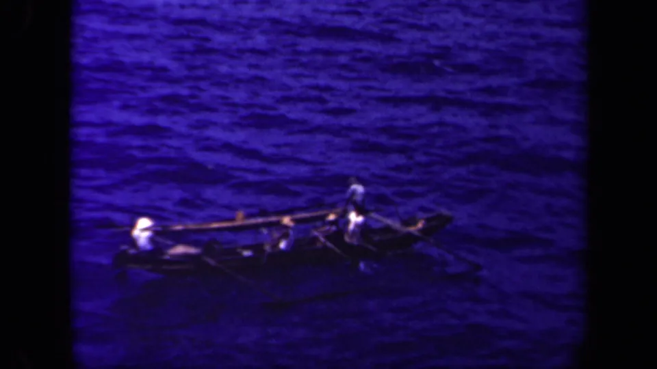 The outrigger canoe appears in a wider 1944 Leyte Gulf view, with passengers seated low and one figure near the side spars.