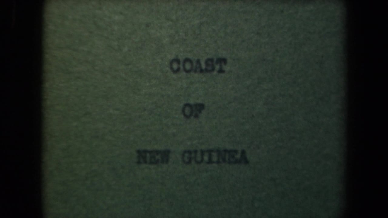 Title card reading Coast of New Guinea on a greenish, grainy frame.
