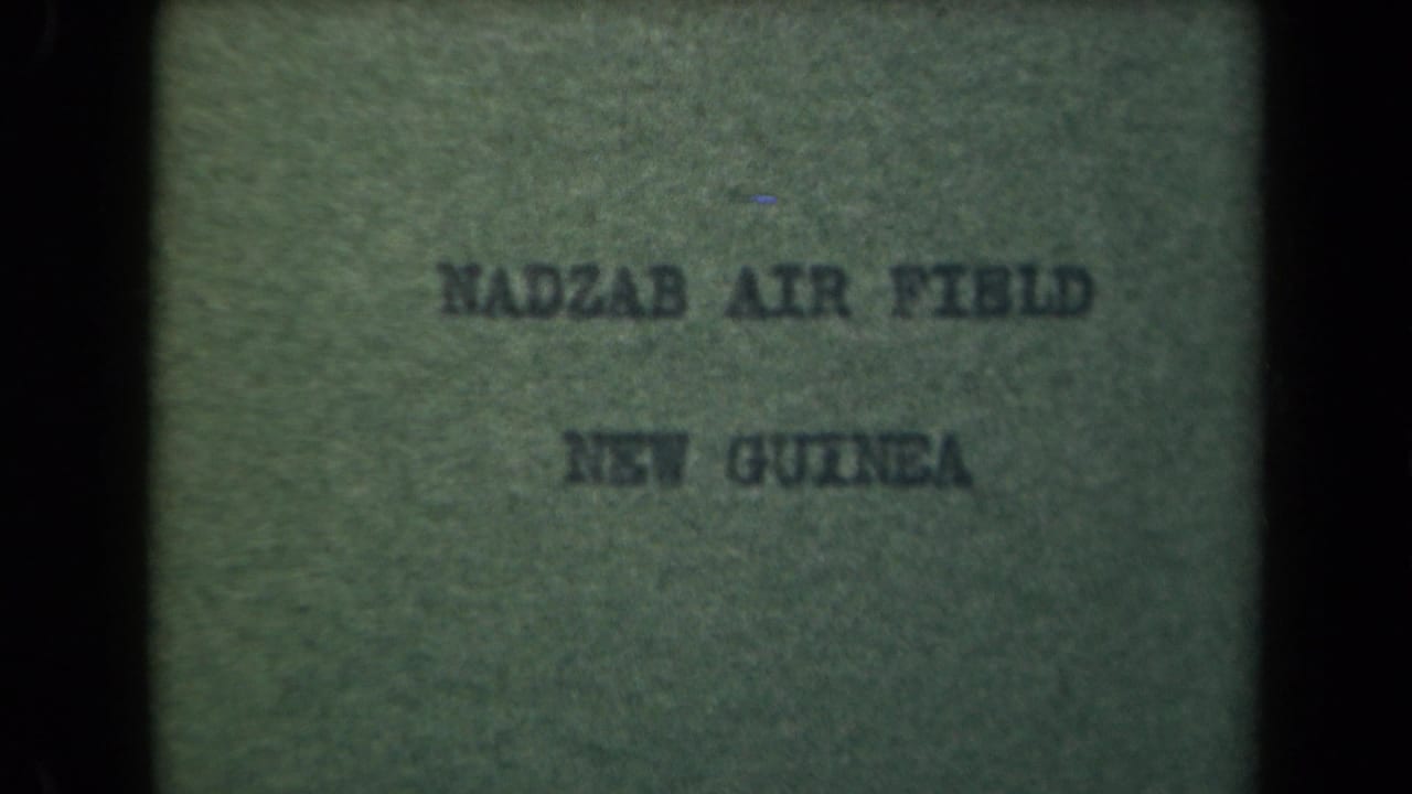Green-tinted title card reading NADZAB AIR FIELD and NEW GUINEA.