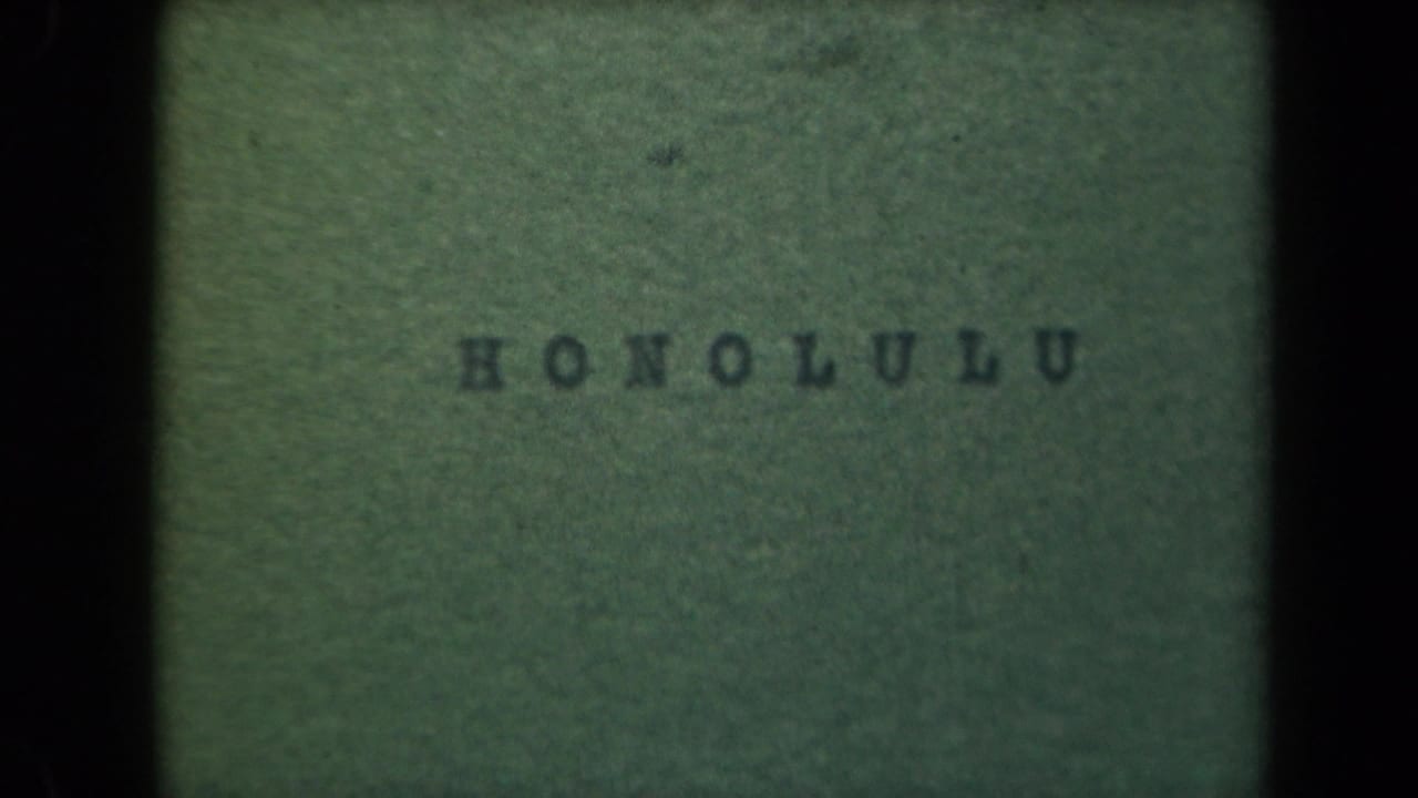 A soft green home-movie title card reads HONOLULU, with dark film borders and visible grain.