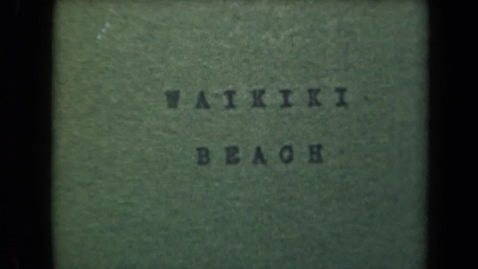 1944 Hawaii 8mm title card on a green background with dark lettering reading WAIKIKI BEACH.