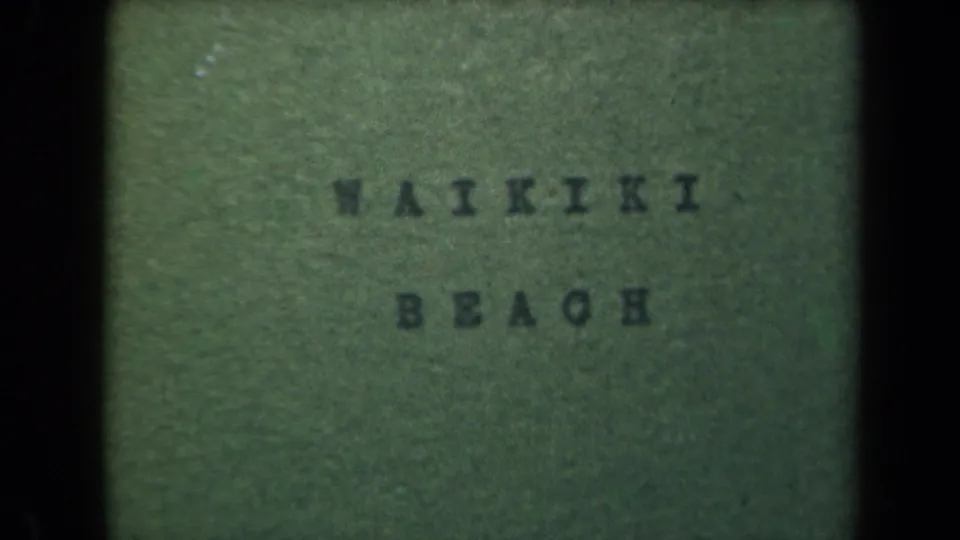 Repeated 8mm title frame for Waikiki Beach, with faded green background, dark letters, and visible film borders.