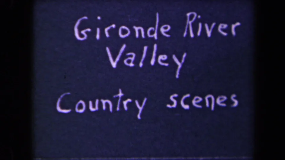 A close 8mm frame of the handwritten Gironde River Valley Country scenes card, with soft focus and visible film texture.