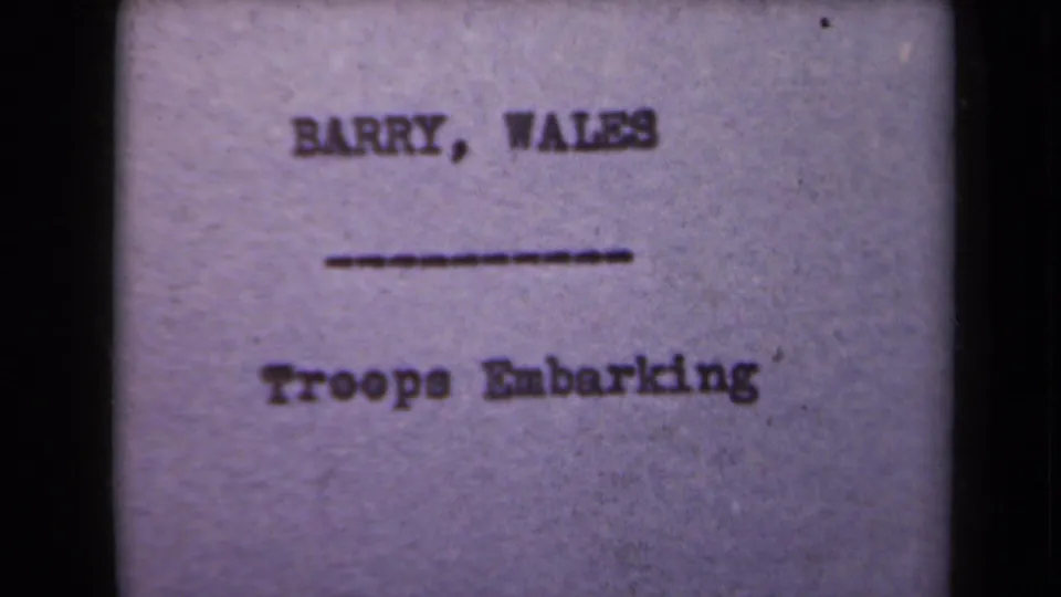 A typed title card identifies the scene as Barry, Wales, with the event labeled Troops Embarking.