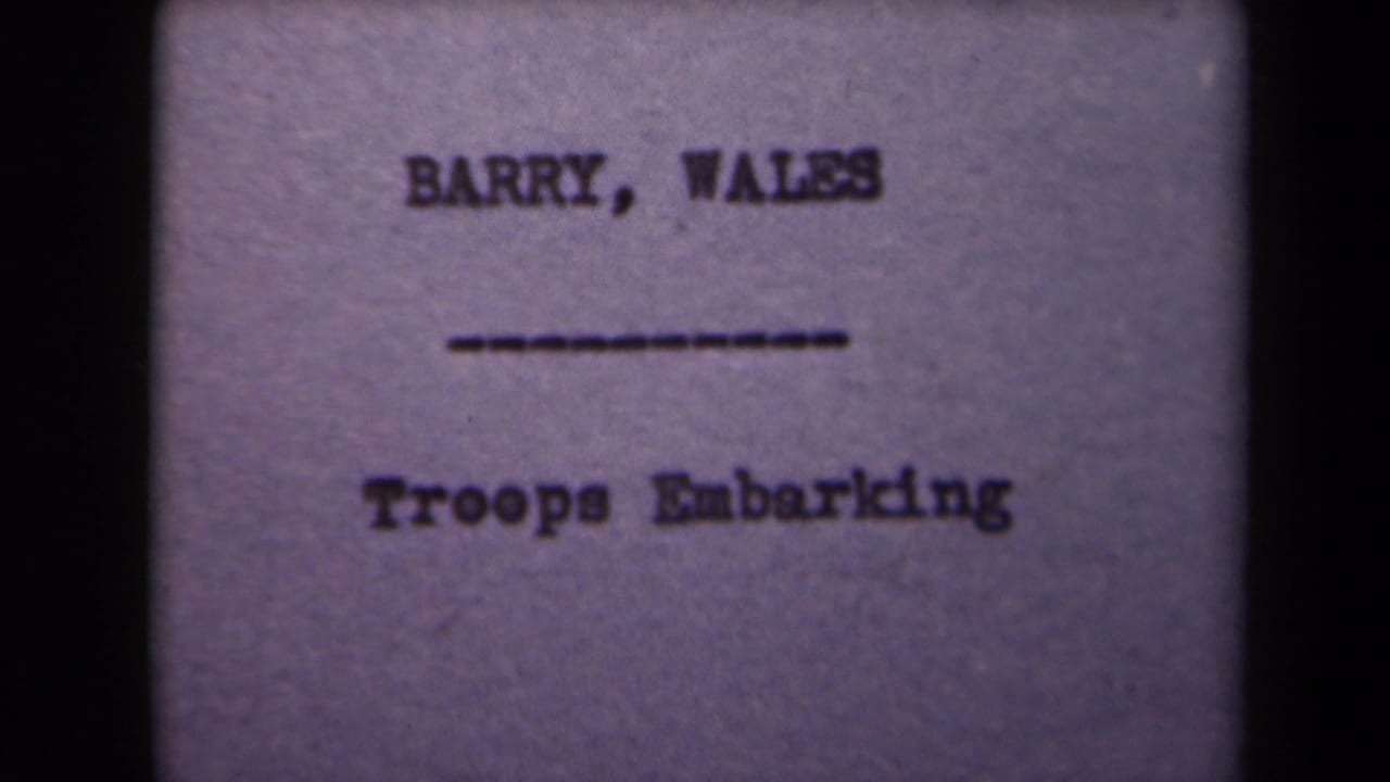 Repeated title card with "BARRY, WALES" and "Troops Embarking" centered on a grainy frame.