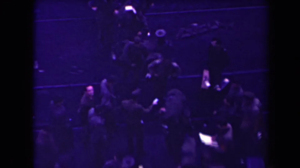 The final frame shows a crowded, low-lit military movement scene with soldiers, gear, and a ramp structure in 1945 France footage.