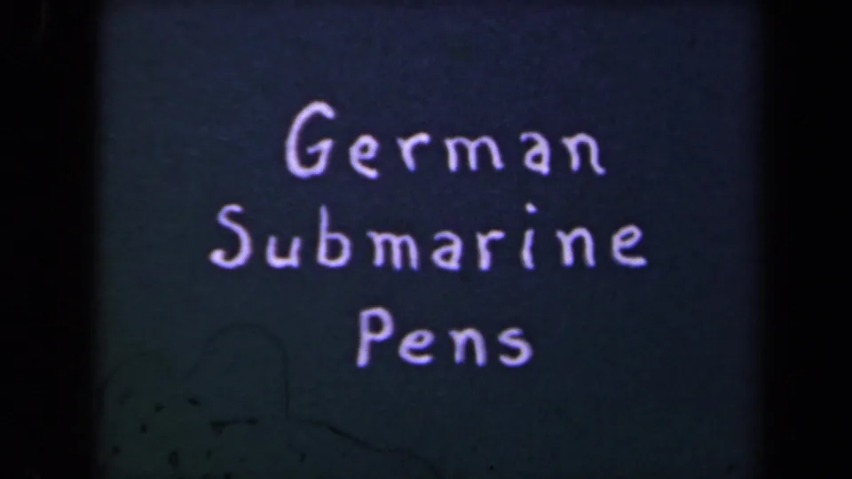 A repeated 8mm title card reading German Submarine Pens, with scratches and color fading visible in the frame.