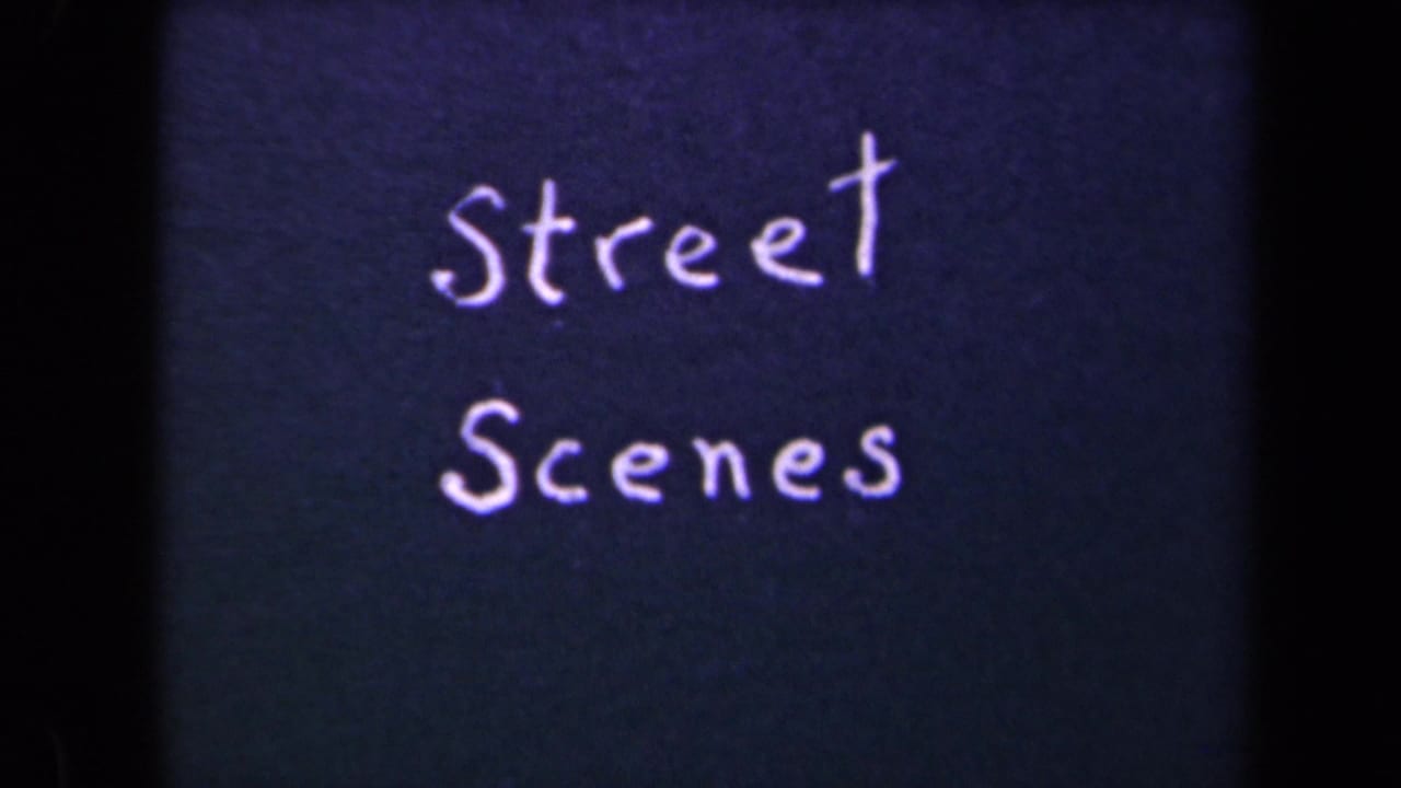 A second view of the handwritten Street Scenes title card, with bright lettering, dark blue background, and visible 8mm frame edges.