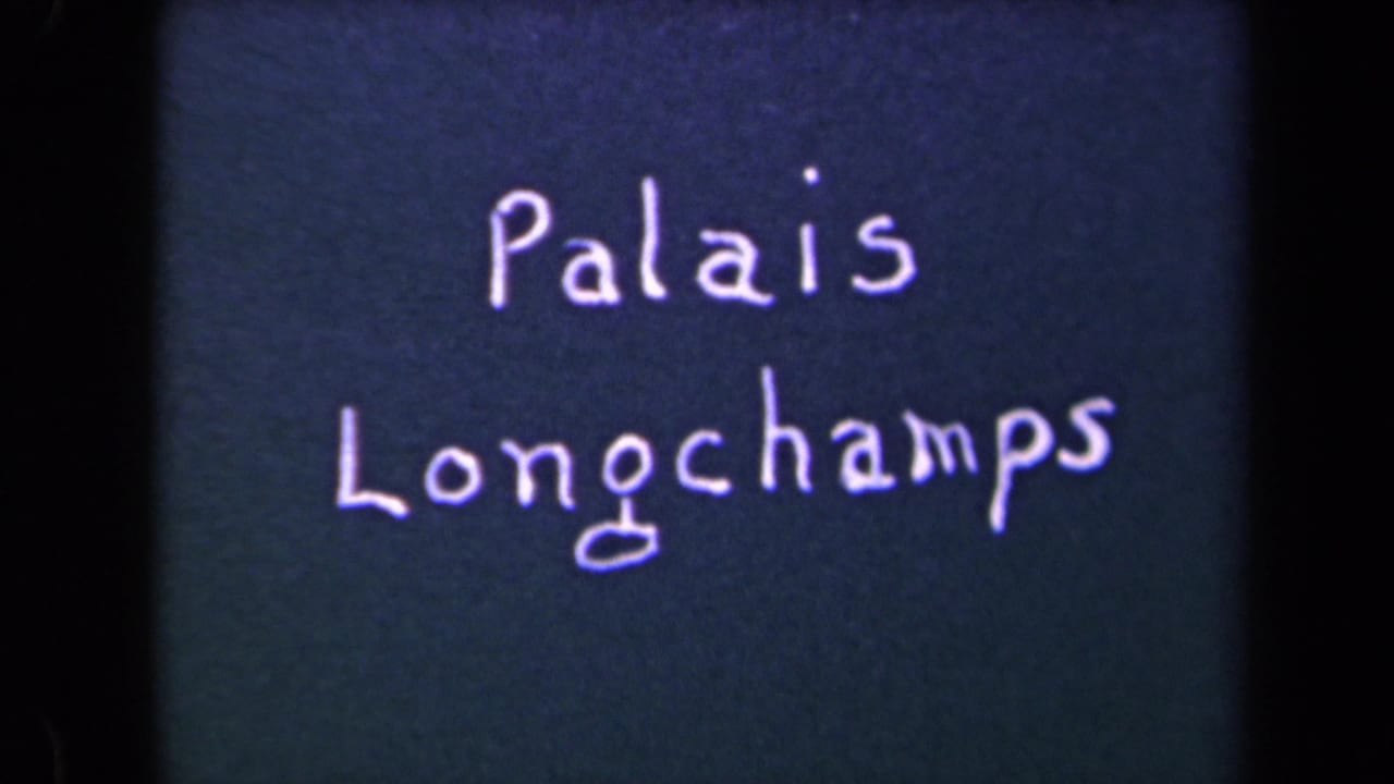 Handwritten words “Palais Longchamps” on a dark title surface.