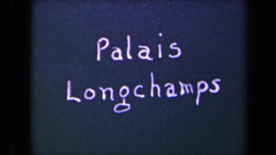 Handwritten French title “Palais Longchamps” appears on a dark surface in 1940s 8mm home-movie footage.