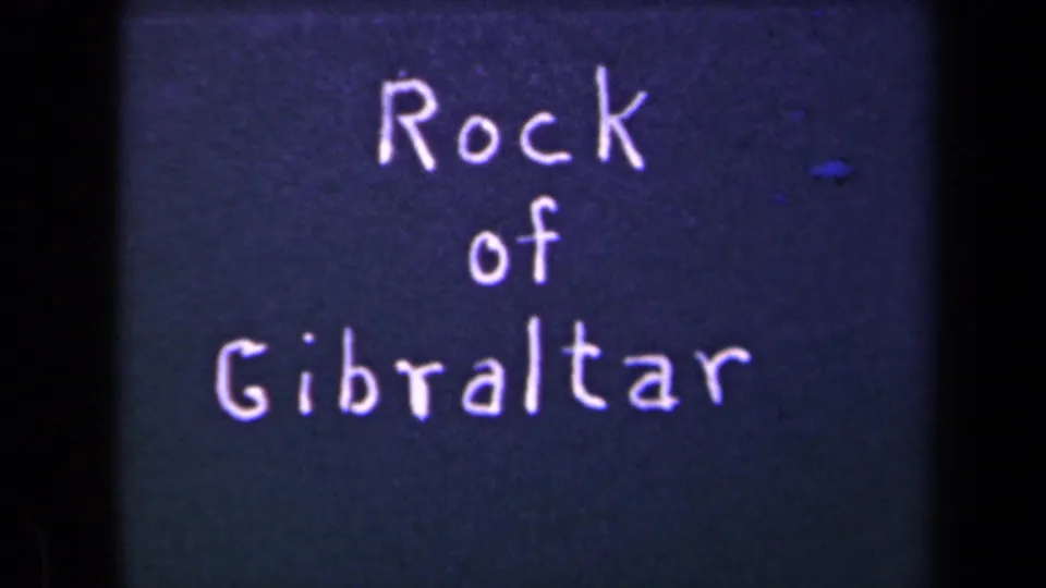 Handwritten title card reads Rock of Gibraltar in white lettering on a dark blue 8mm film background.