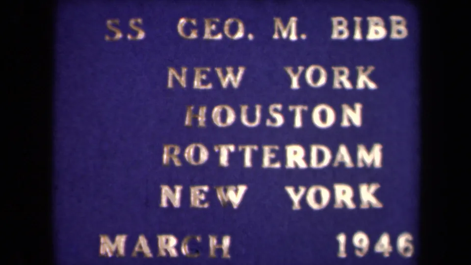 Close 8mm frame of the SS Geo. M. Bibb route card, with New York, Houston, Rotterdam, and March 1946 visible.