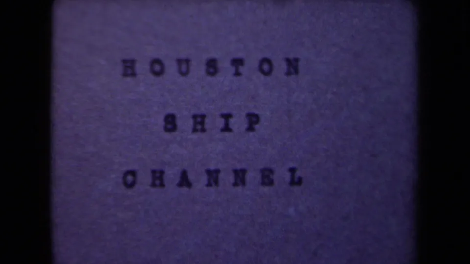 1946 8mm title card with the words HOUSTON SHIP CHANNEL on a purple-toned background.