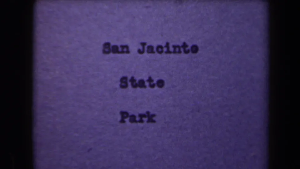 Centered 8mm title card reading San Jacinto State Park in dark typewriter-style text on a faded purple background.