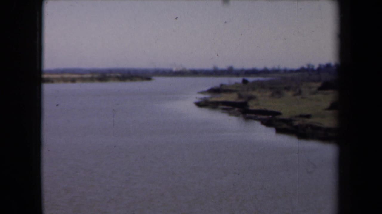 Wide water view with shoreline curving along the right edge.