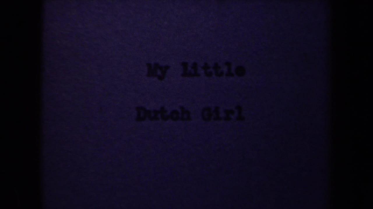 1946 8mm Netherlands home-movie title card reading My Little Dutch Girl, seen with grain, soft focus, and dark frame edges.