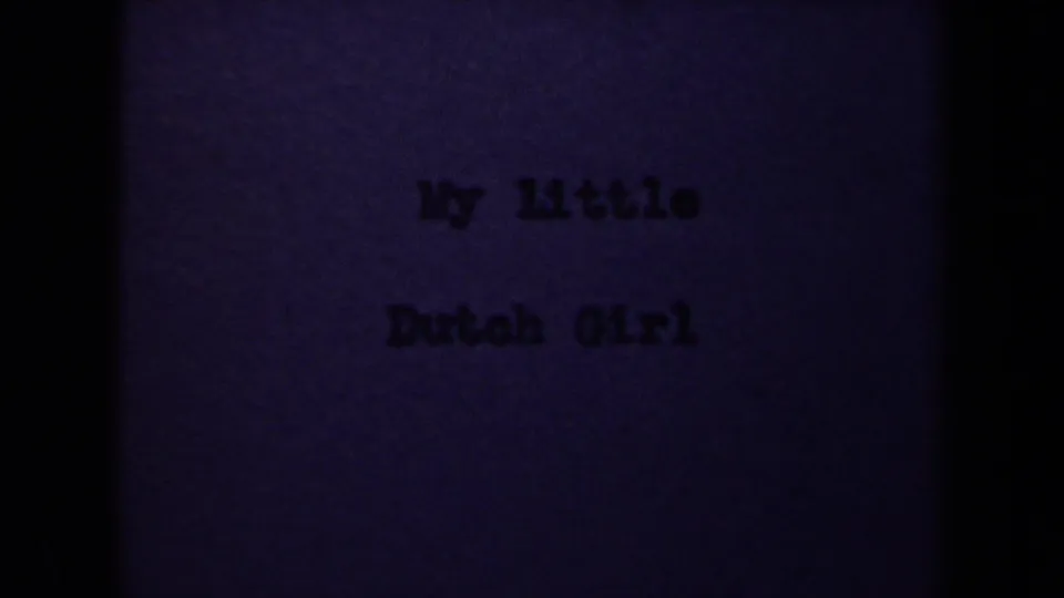 1946 8mm Netherlands home-movie title card reading My Little Dutch Girl, seen with grain, soft focus, and dark frame edges.