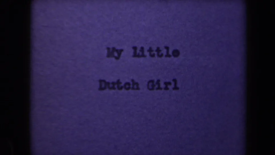 1946 home-movie title frame showing My Little Dutch Girl in dark type on a purple-tinted, grainy 8mm card.