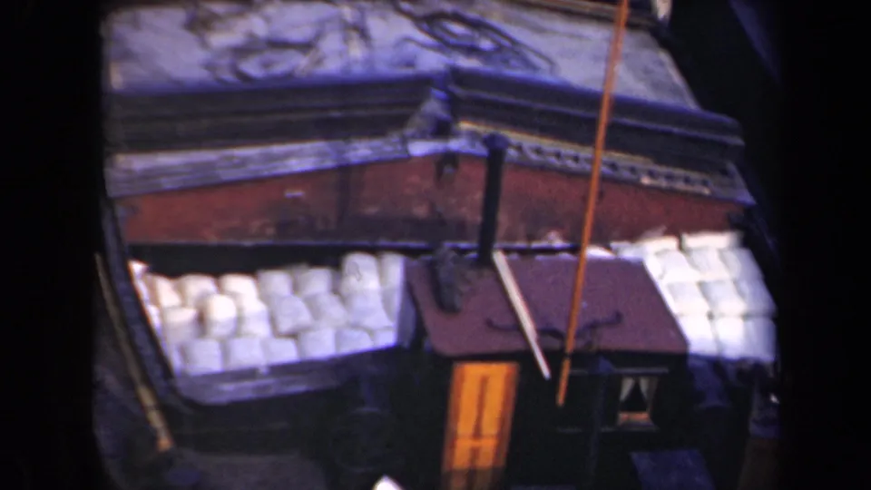 1946 Netherlands 8mm frame focused on a barge corner with white cargo, painted trim, and a small deck structure.
