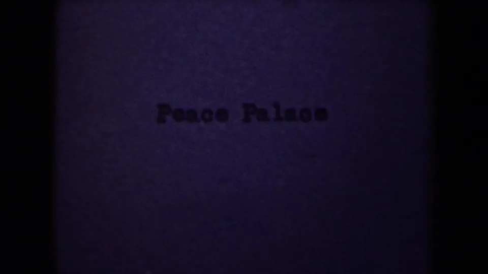 Home-movie title card reading Peace Palace, confirming the clip's identified landmark subject.