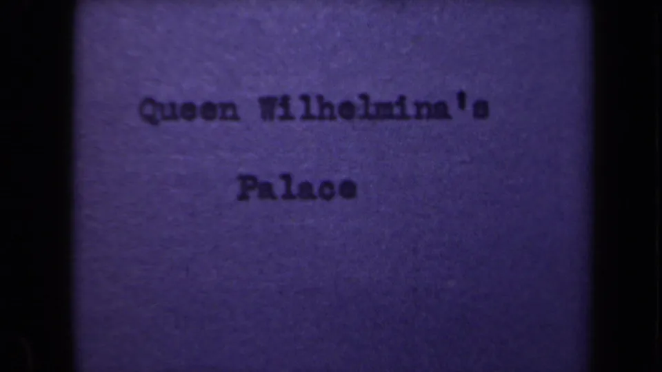 Purple 8mm title card from the Netherlands clip, typed with the words Queen Wilhelmina's Palace.