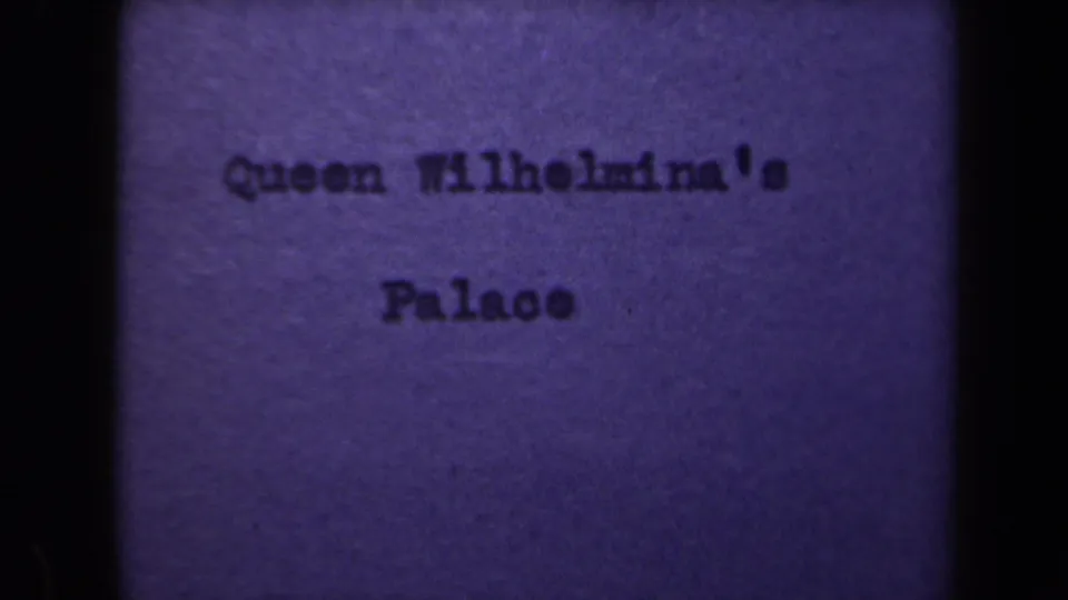 1946 8mm title card identifying Queen Wilhelmina's Palace before the Netherlands street exterior footage.